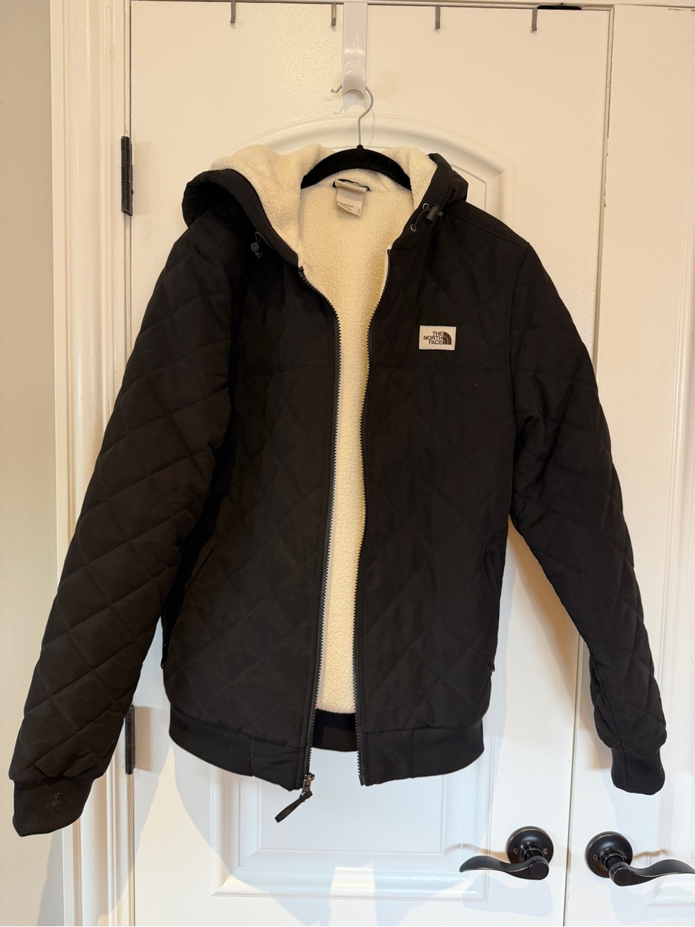 The North Face Black Quilted Hooded Jacket with Cream Sherpa Lining